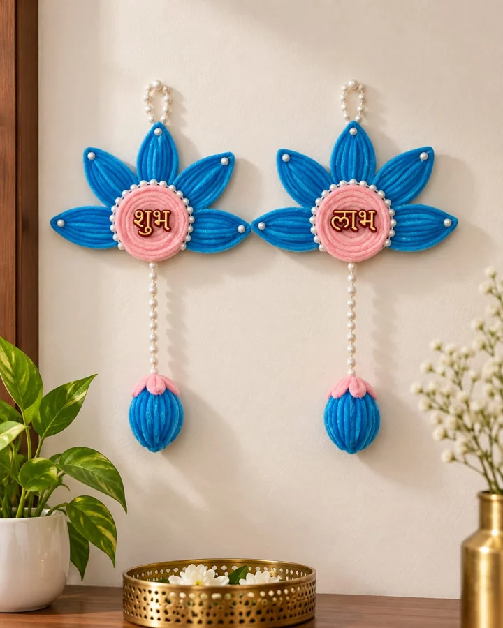 A blue and blush-pink Shubh Labh design with pearl-like strings and soft floral drops. A pair is pictured.