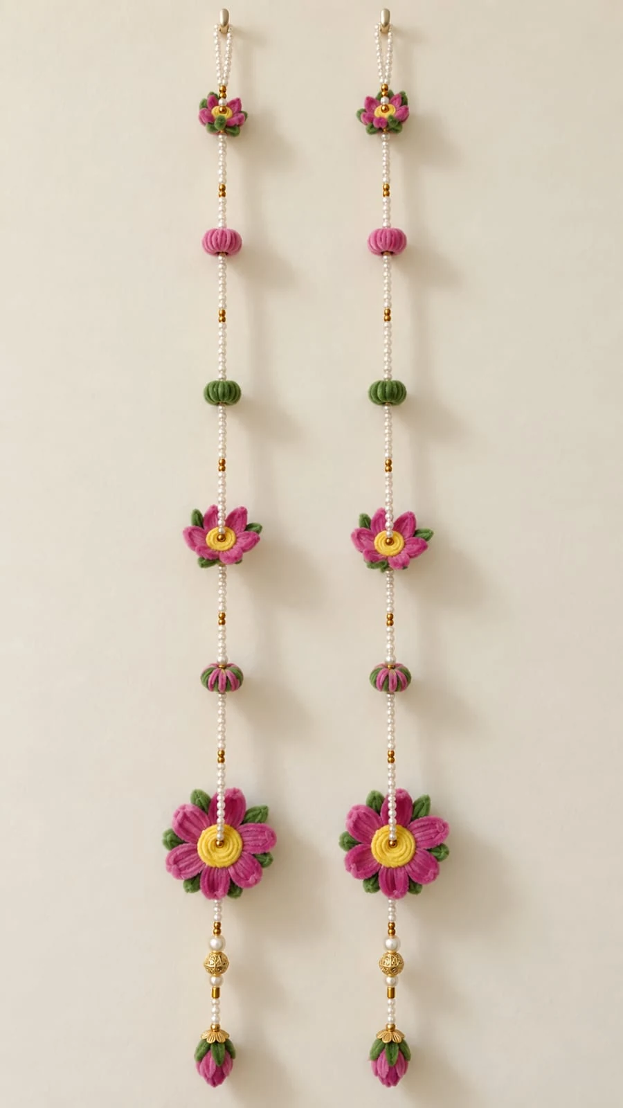 Rose Garden Strings: Delicate pink flowers and green accents along pearl-like strings, finished with decorative gold-toned beads. Two strings are pictured; the price is for one string.