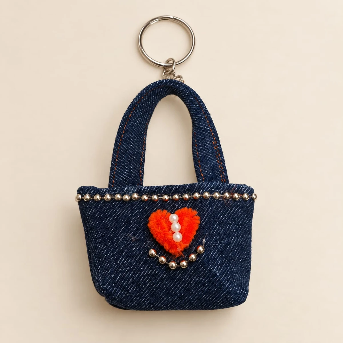 Tiny Heart Tote: A miniature denim tote decorated with an orange heart and silver-toned beads.